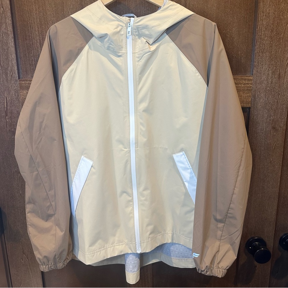 Fabletics Downpour Rain Jacket in Beige and Cream